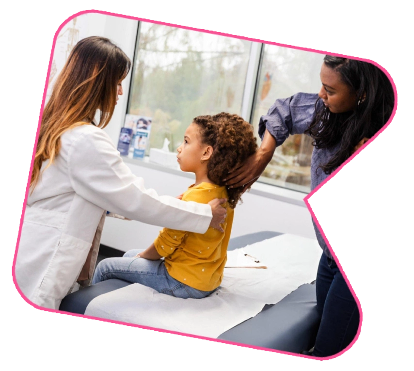 Developmental pediatrician assessing child with parent present.